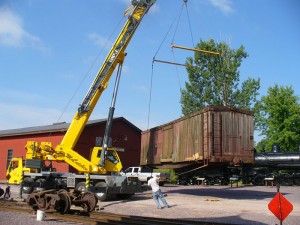 A crane unloads LS&I boxcar #2011 at North Freedom on July 19, 2007. Jim Connor photo.