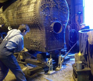 Jason and Ed jack the boiler to level position in preparation for work next week.