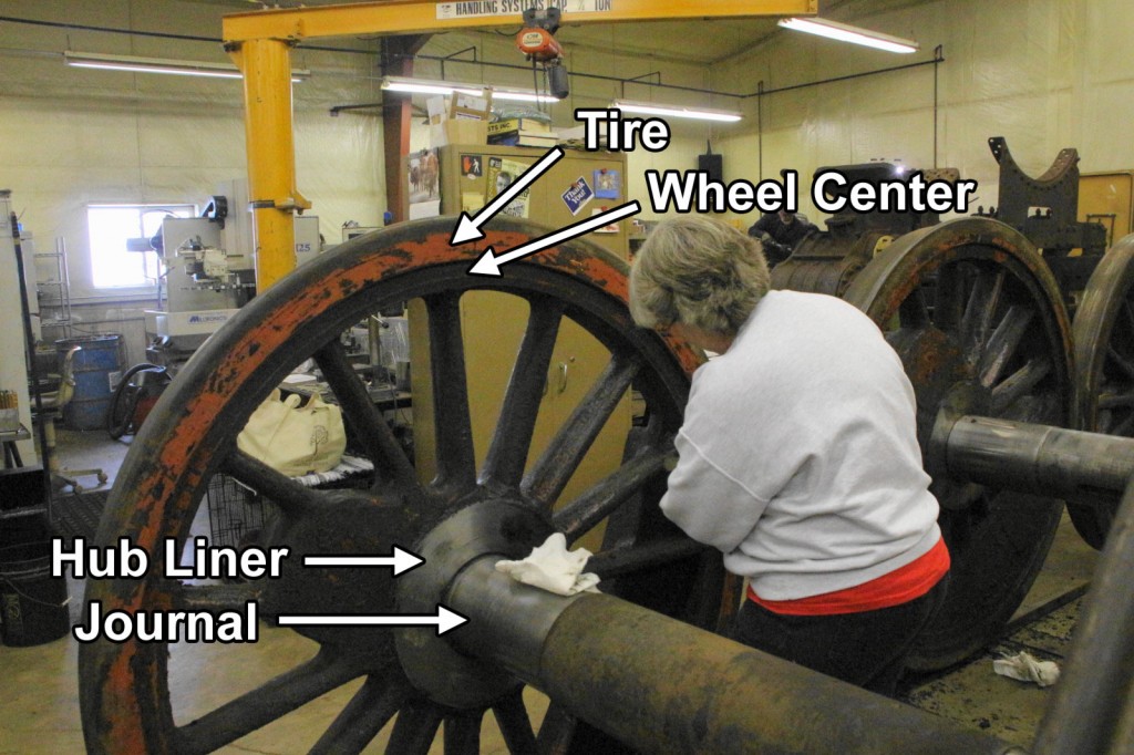 Volunteer Nancy Kaney cleans one of 1385's drivers. Important parts are identified. See the Jan. 11, 2014 post for more photos from that day. Brian Allen photo.