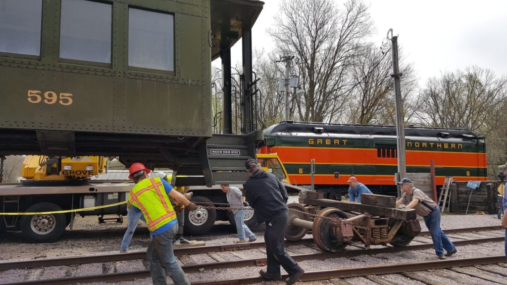 Volunteers pulling a truck under DL&W 595