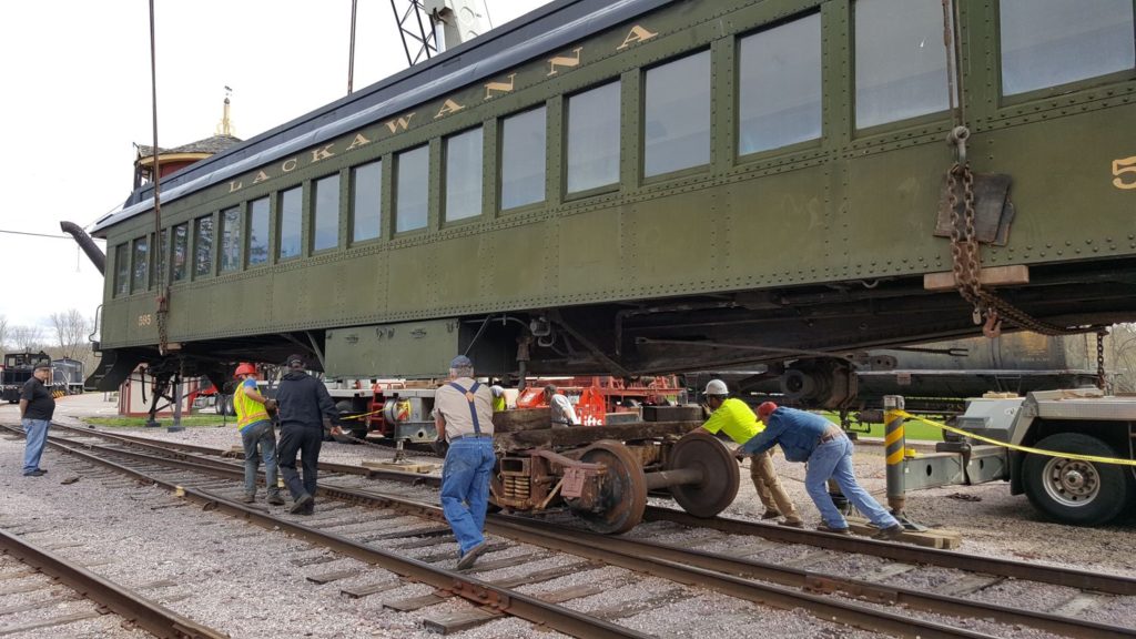 Volunteers pulling a truck under DL&W 595