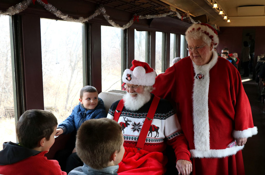 Santa on train talking to kids