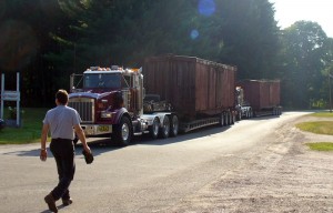 Two LS&I boxcars arrive on three semis from Ishpeming, MI on July 19, 2007.