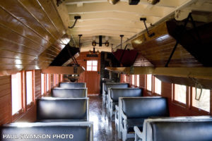 interior view of drovers caboose showing seating and above-seat sleeping berths in the lowered position