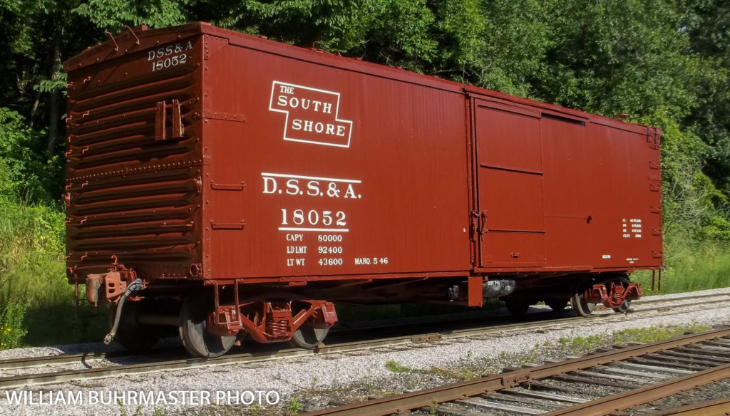 Dull red colored boxcar with The South Shore stylized logo and reporting marks of DSS&A number 18052. Photo credited to William Buhrmaster