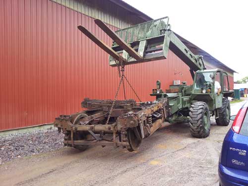 car trucks being carried by forklift