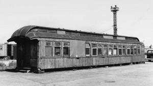 A diamond in the rough has been found! MLS&W coach #63, disguised since 1930 as C&NW's Wood St. Potato Mart office in Chicago, is examined by its new owners, Mid Continent Railway Museum, in October 1970 prior to its move to the museum. Photograph by Ray Buhrmaster.